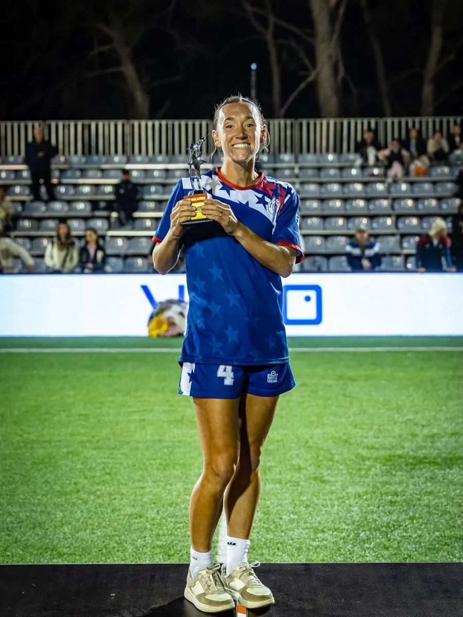 Anna Evans holds her Top Goalscorer award